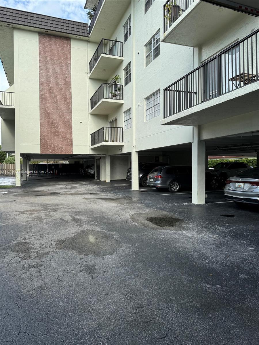 a view of a car park in front of house