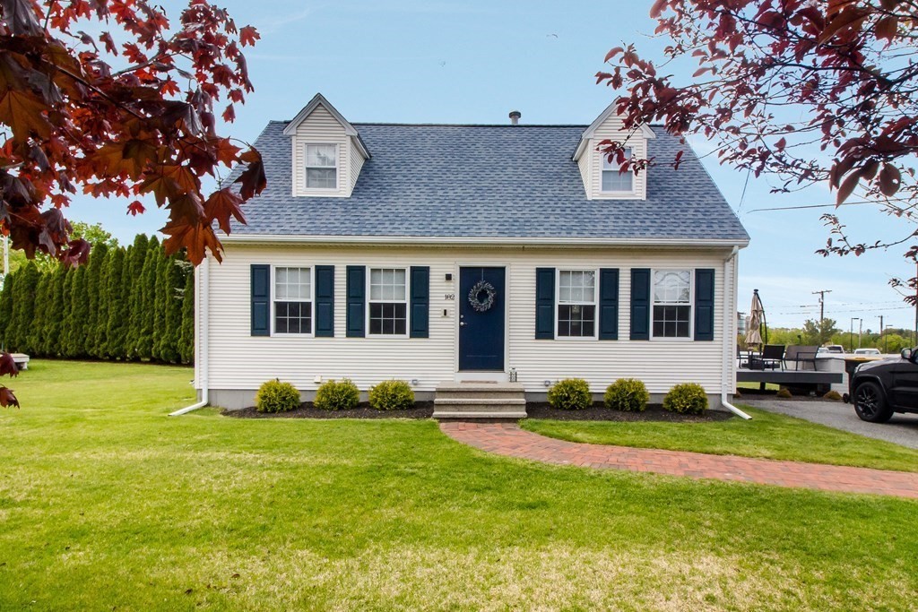 a front view of a house with a yard