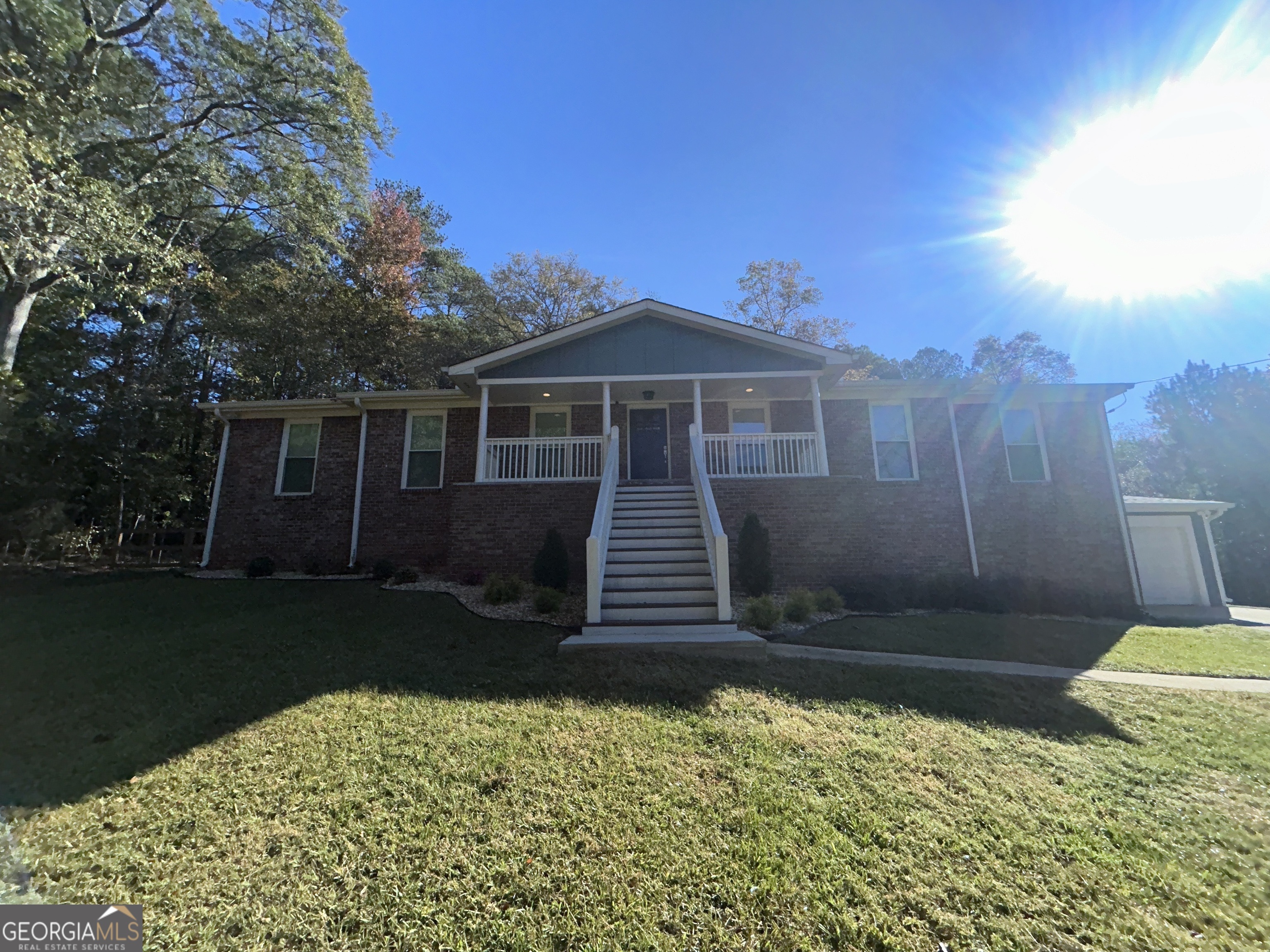 a front view of a house with garden