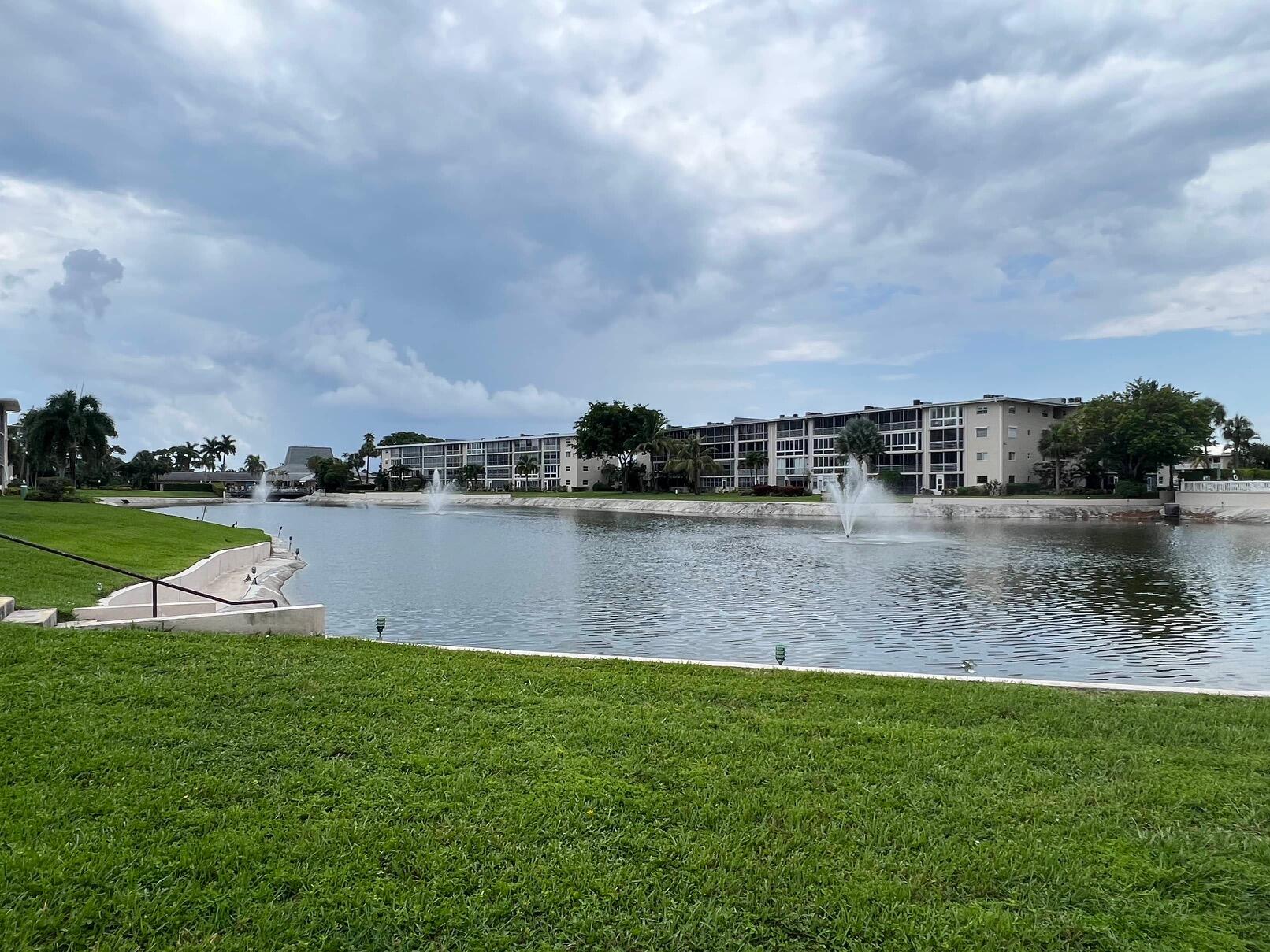 a view of a lake with houses in background