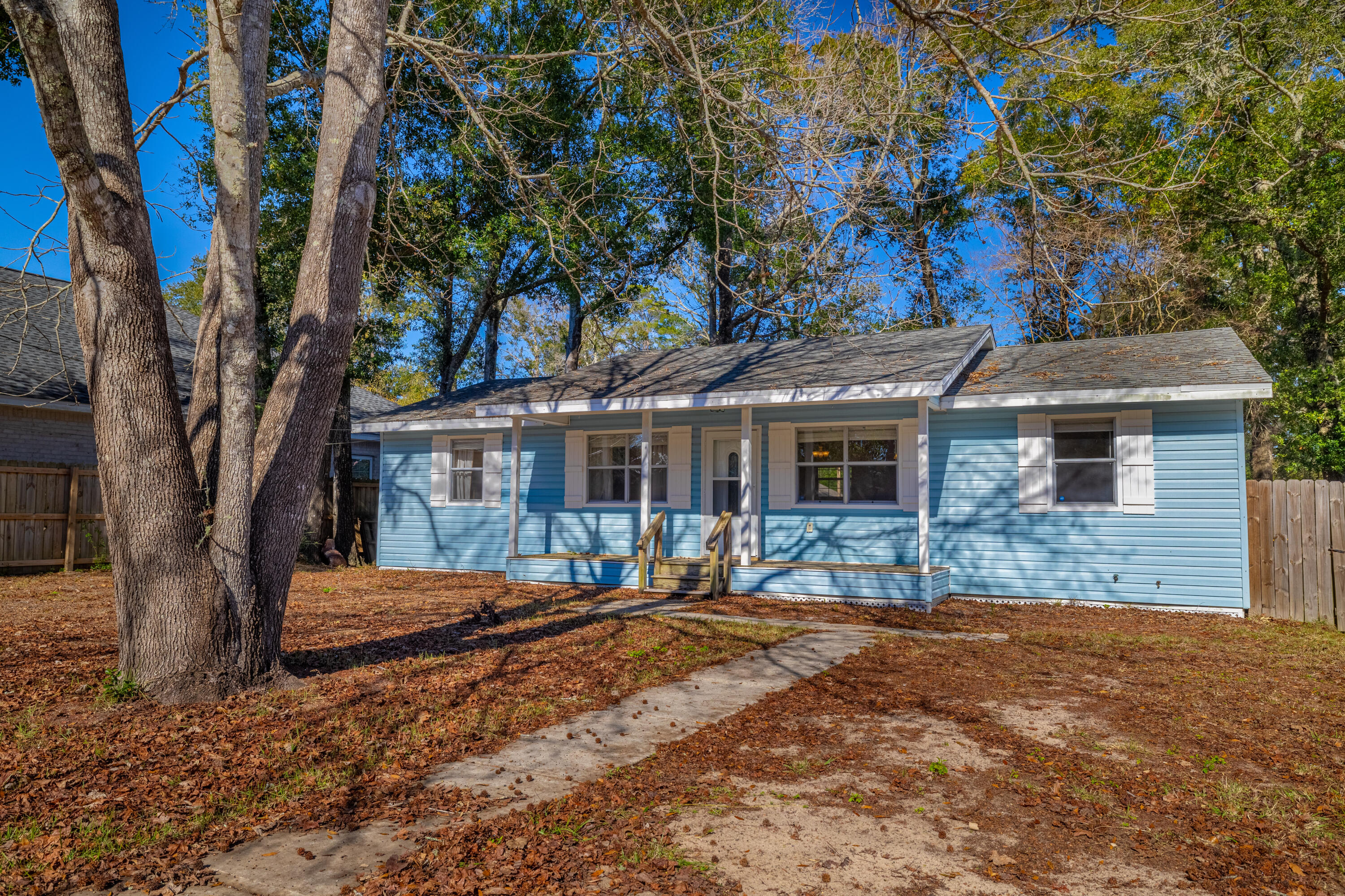 a house with trees in the background