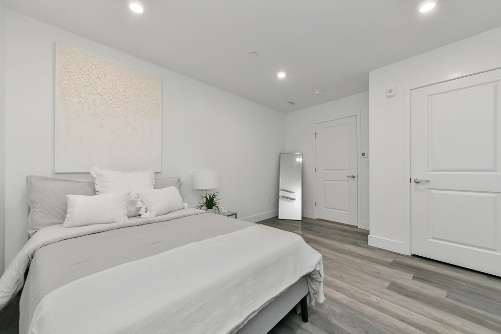 a large white bed in a white room