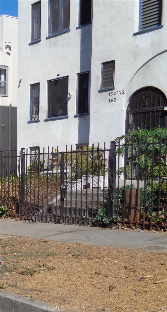 a front view of a building with street view