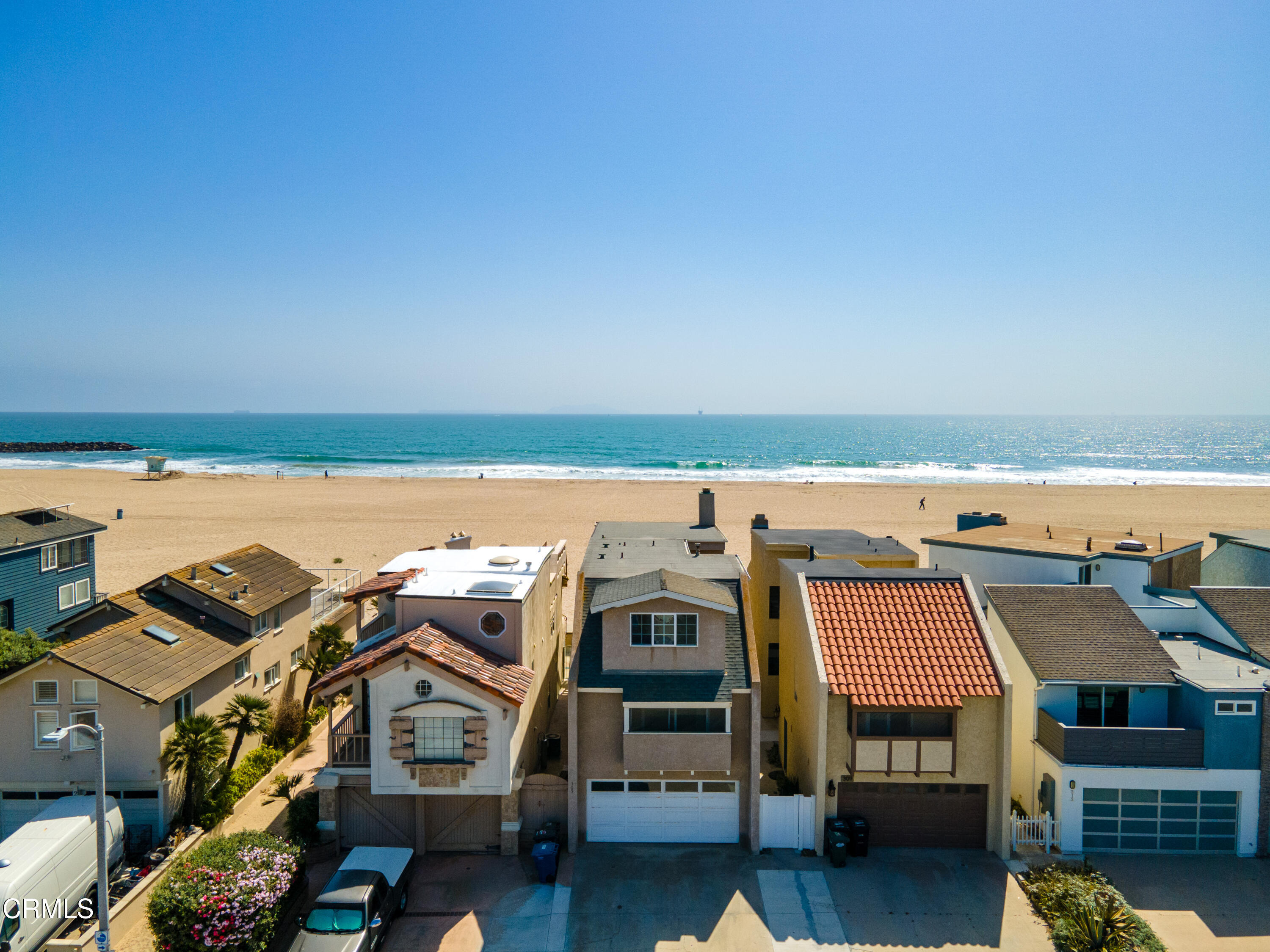 an aerial view of a house with a ocean view