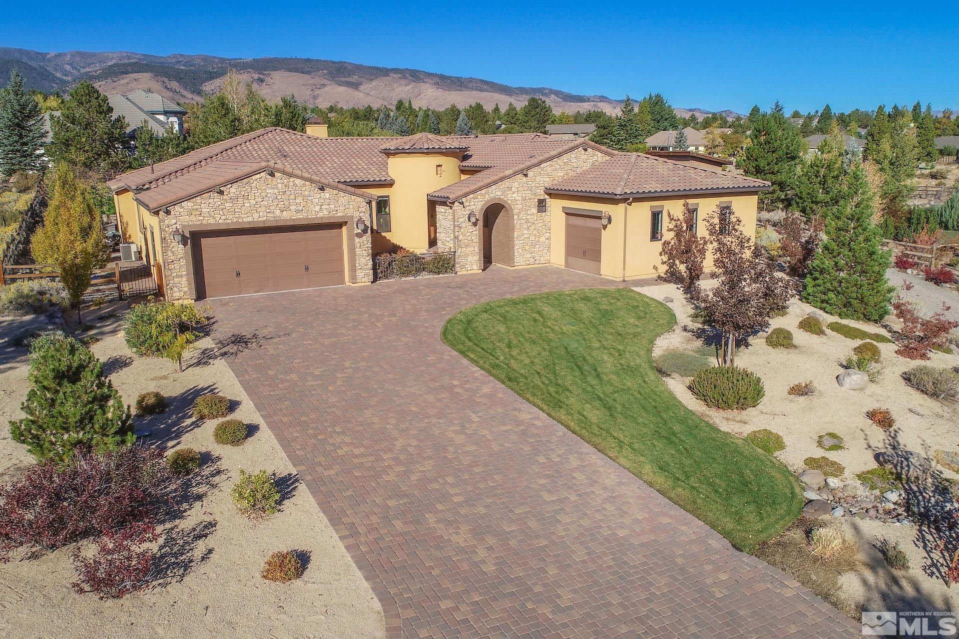 a aerial view of a house with a yard