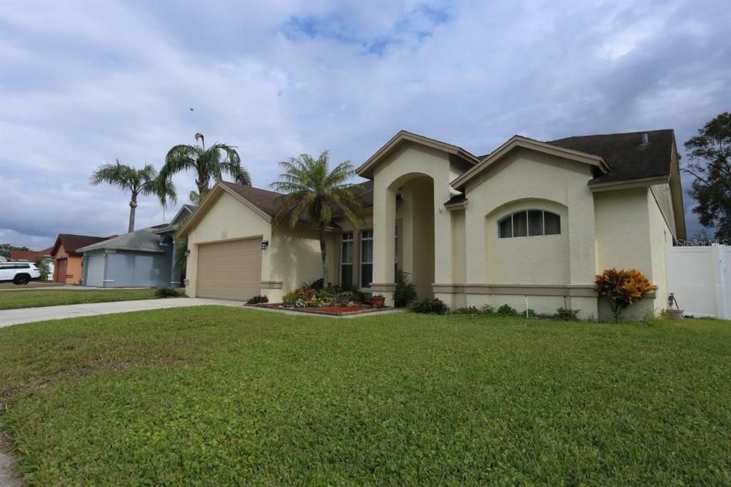 a front view of a house with a yard