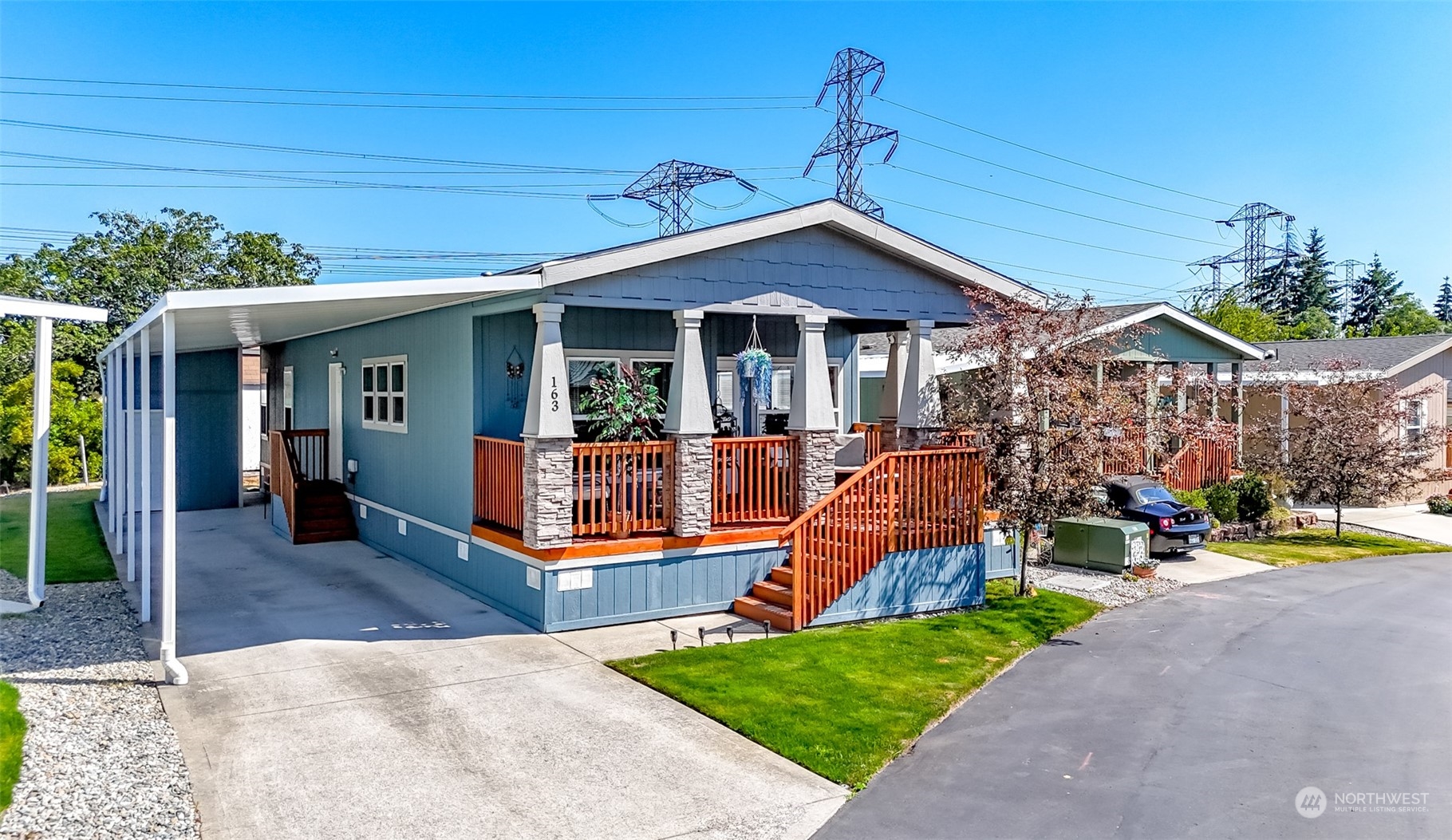 a front view of a house with swimming pool outdoor seating