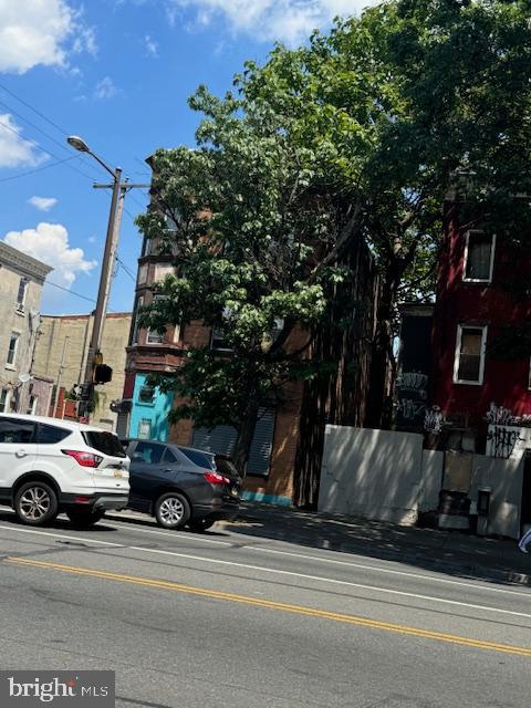 a view of street with parked cars