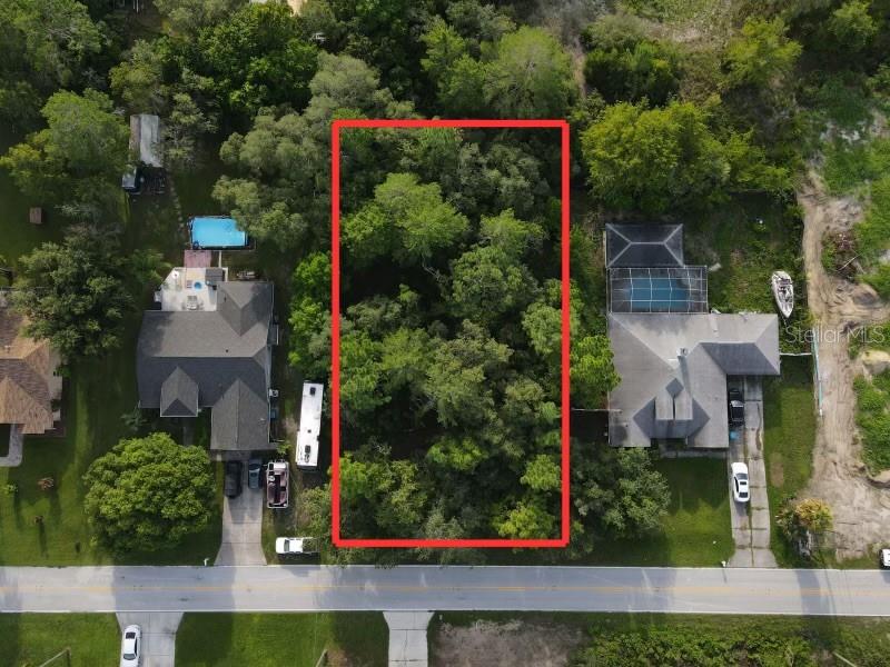 an aerial view of residential house and outdoor space