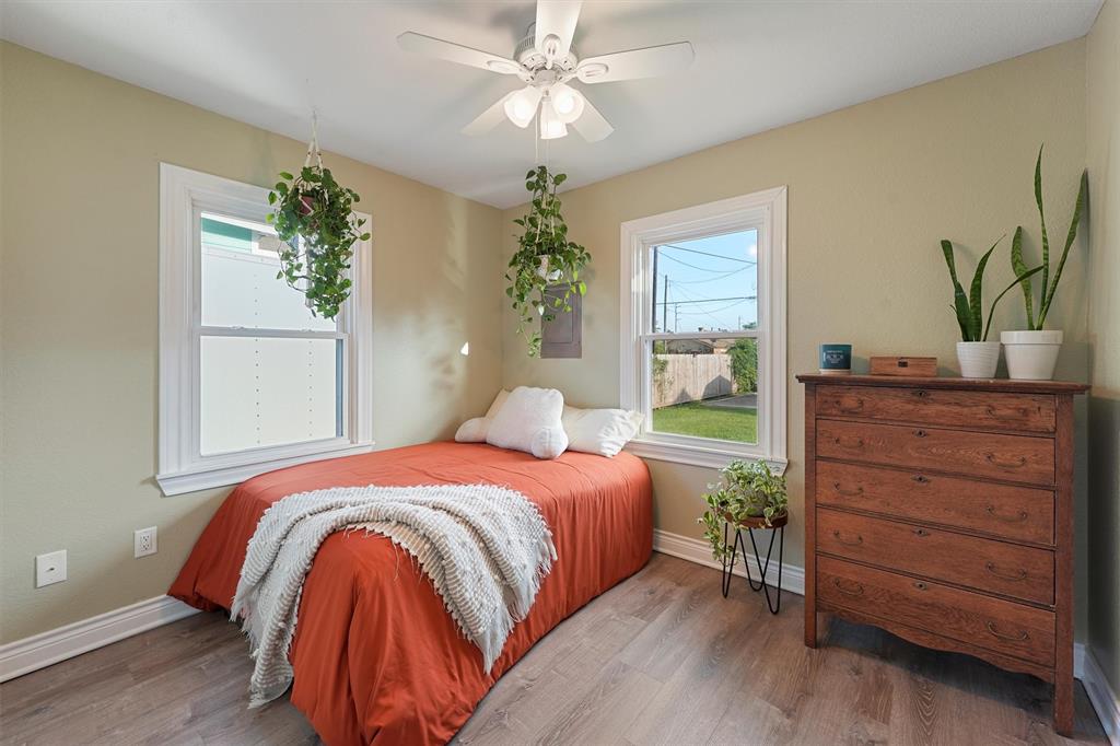 a bedroom with a bed and a dresser