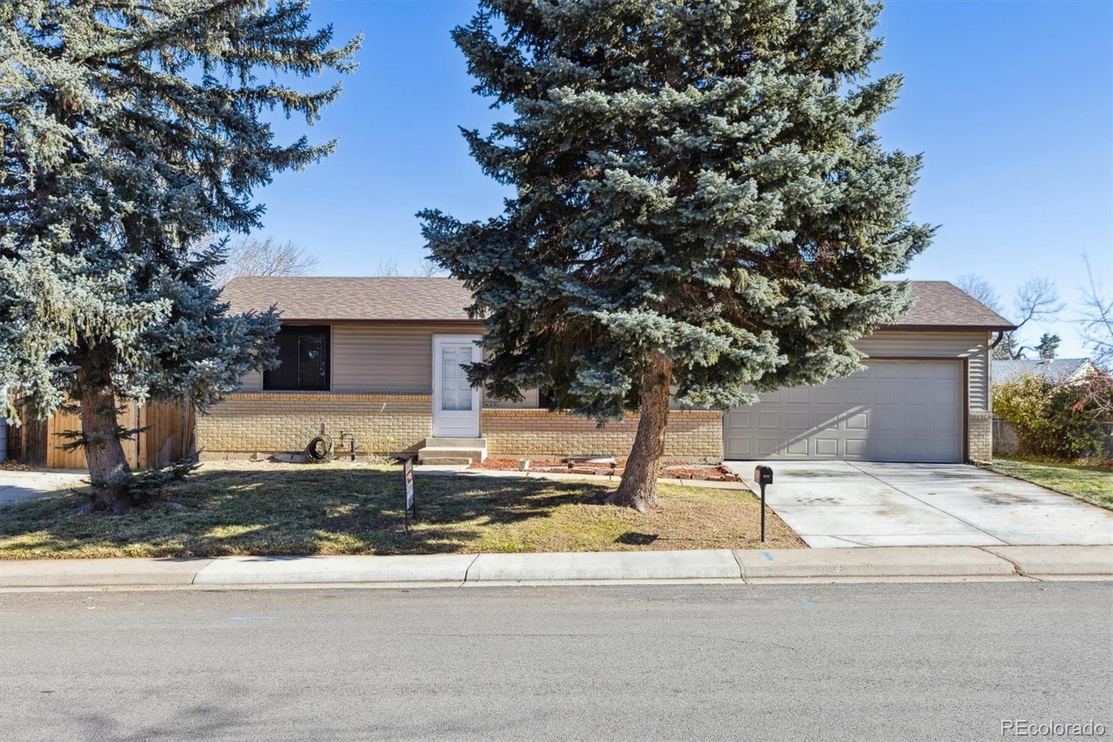 a house with trees in the background