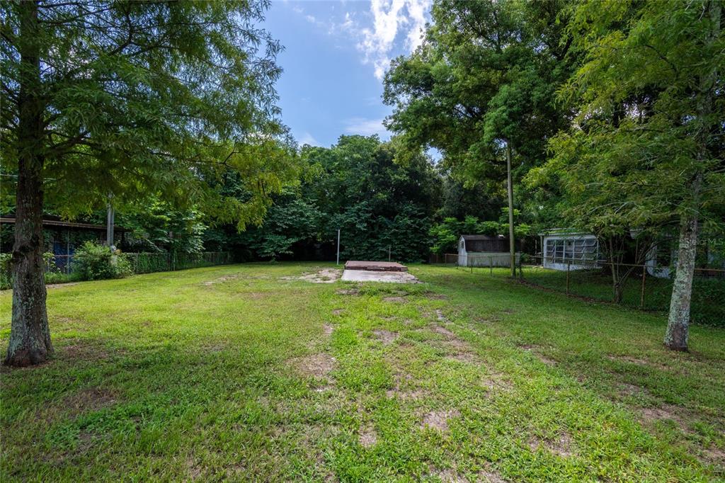 Fully fenced vacant lot.