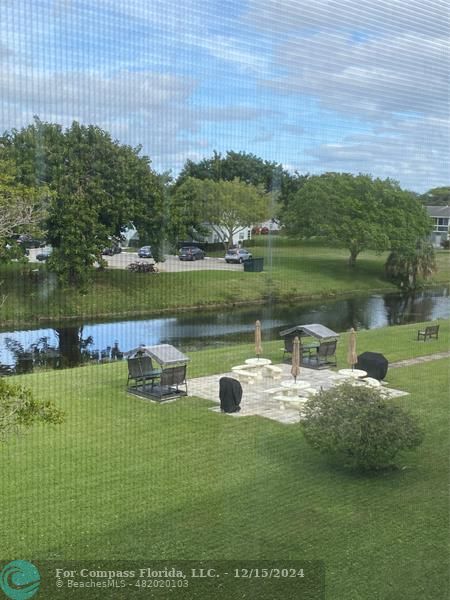 a view of a lake with a big yard