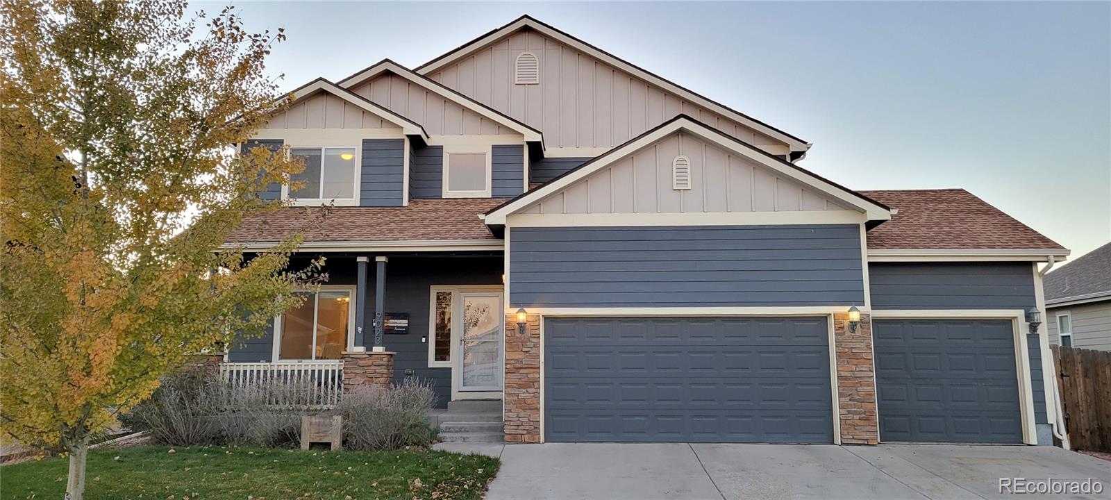 a front view of a house with garage