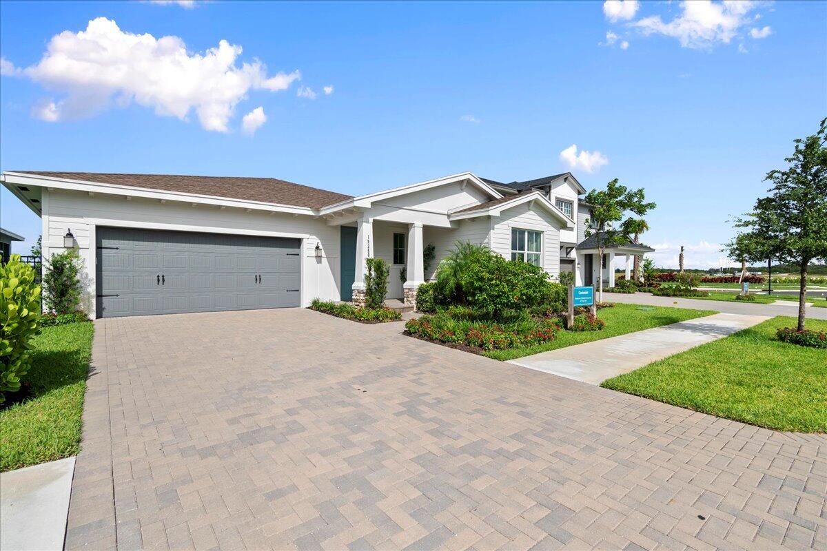 a view of house with yard and green space