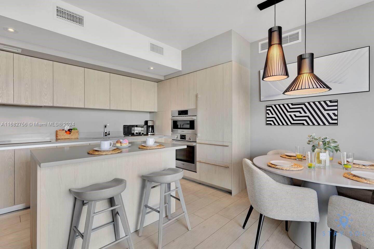 a kitchen with a sink cabinets and window