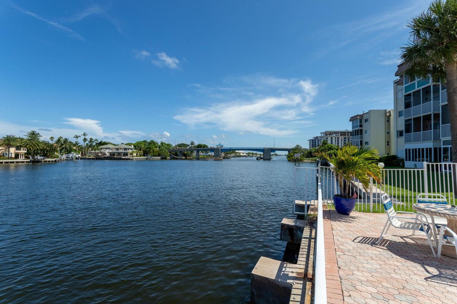 a view of a lake with a house in the background