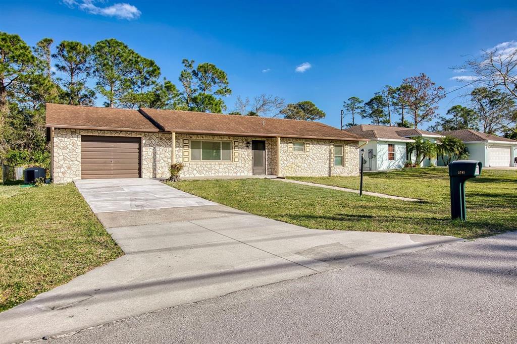 front view of a house with a small yard