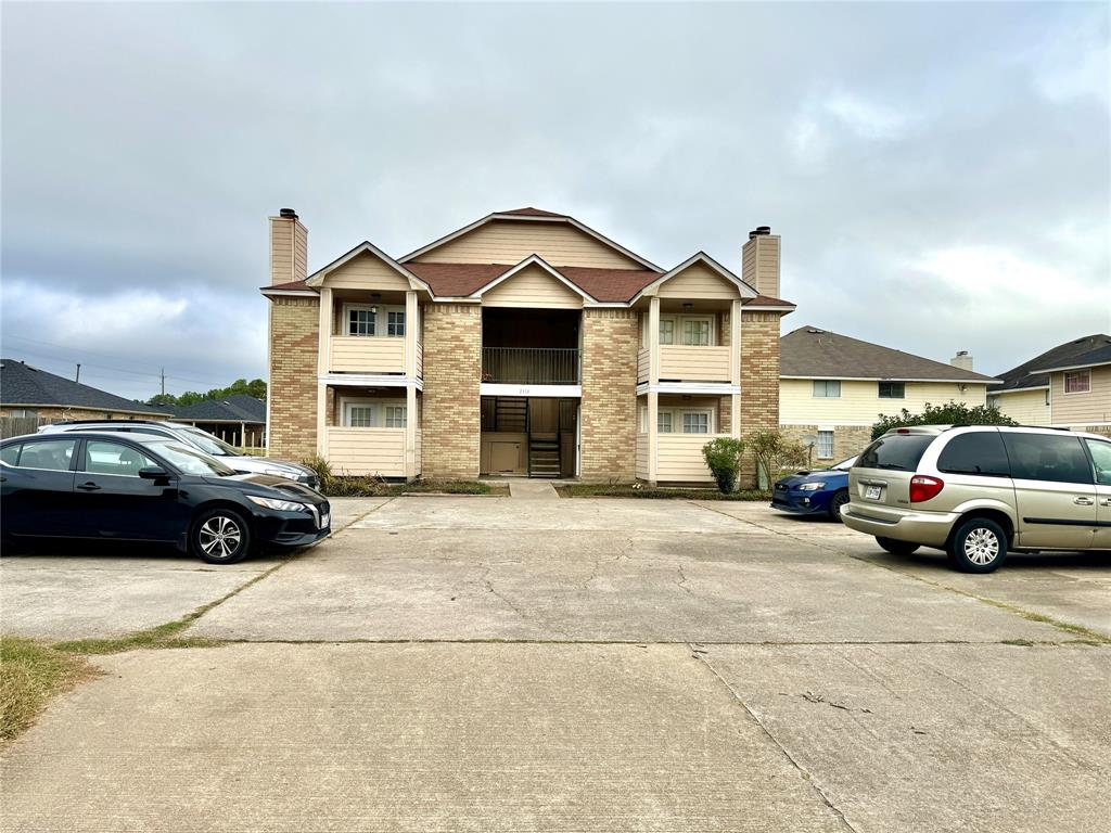 a view of a car parked in front of a house