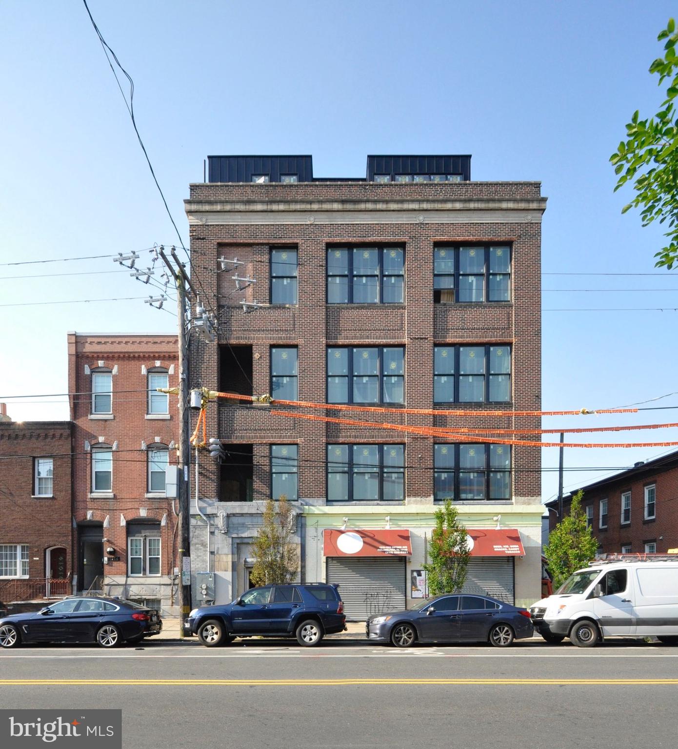 a front view of a building with street view