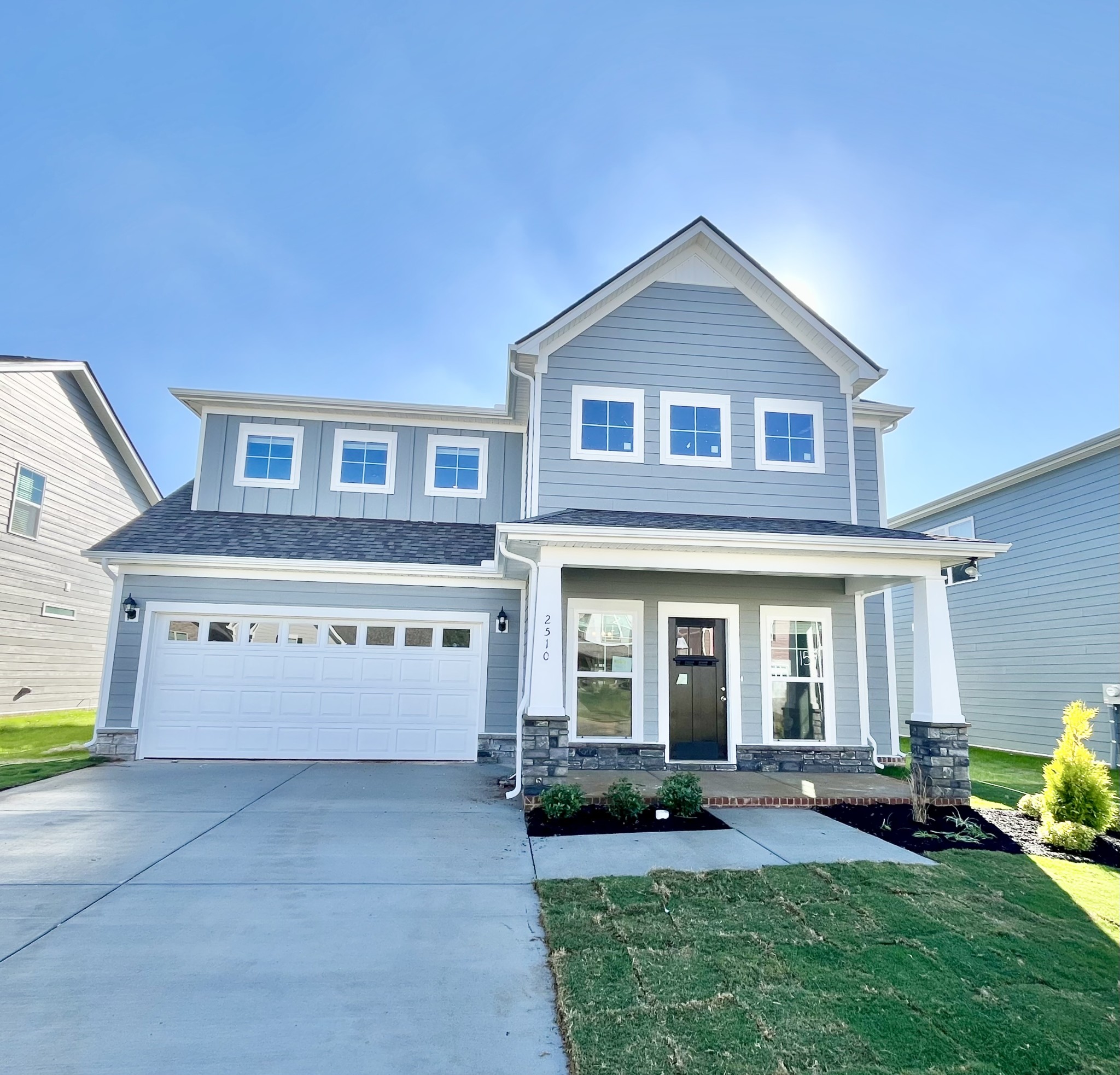 Farmhouse style in the city. Wonderful grey tones with crisp white trim.