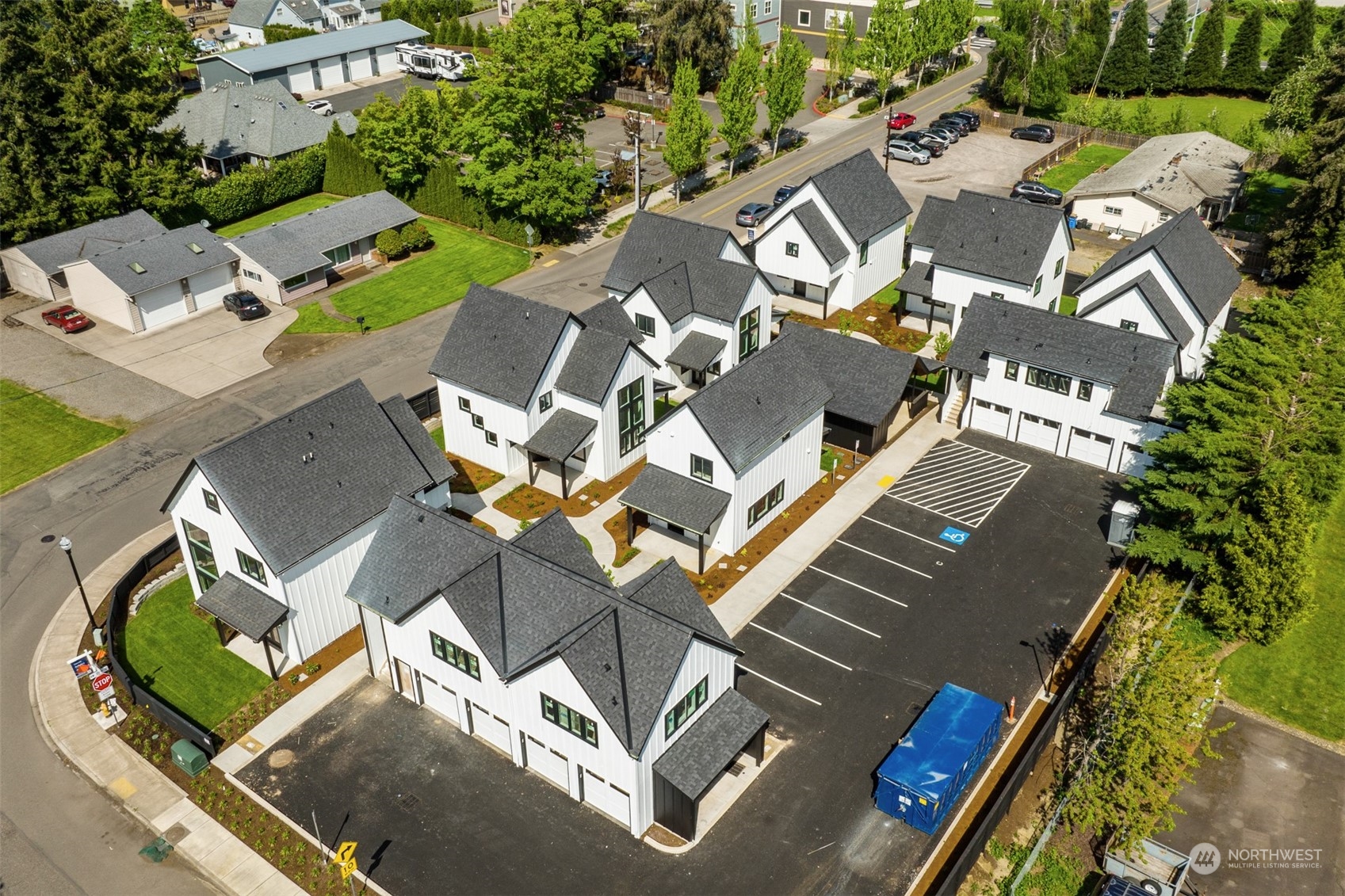 an aerial view of residential house with outdoor space and parking