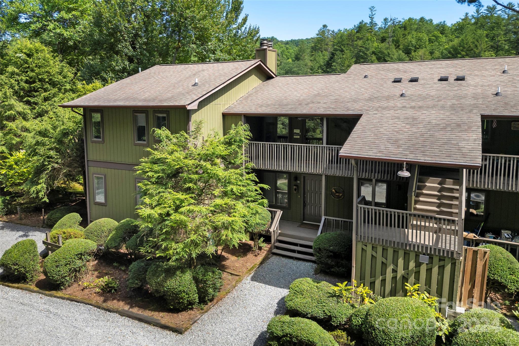 a aerial view of a house with a garden and plants