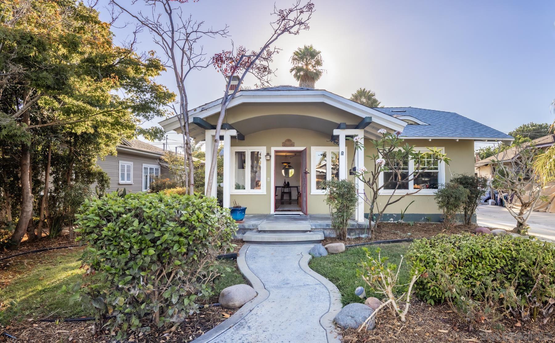 a front view of a house with garden