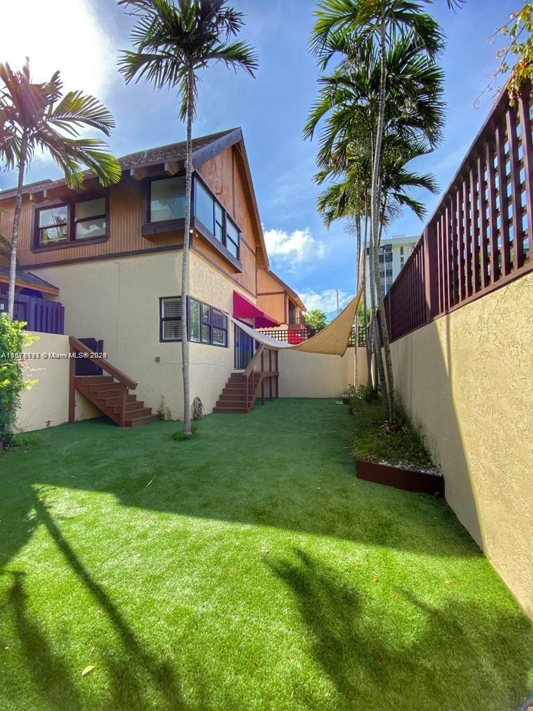 a front view of house with yard and entertaining space