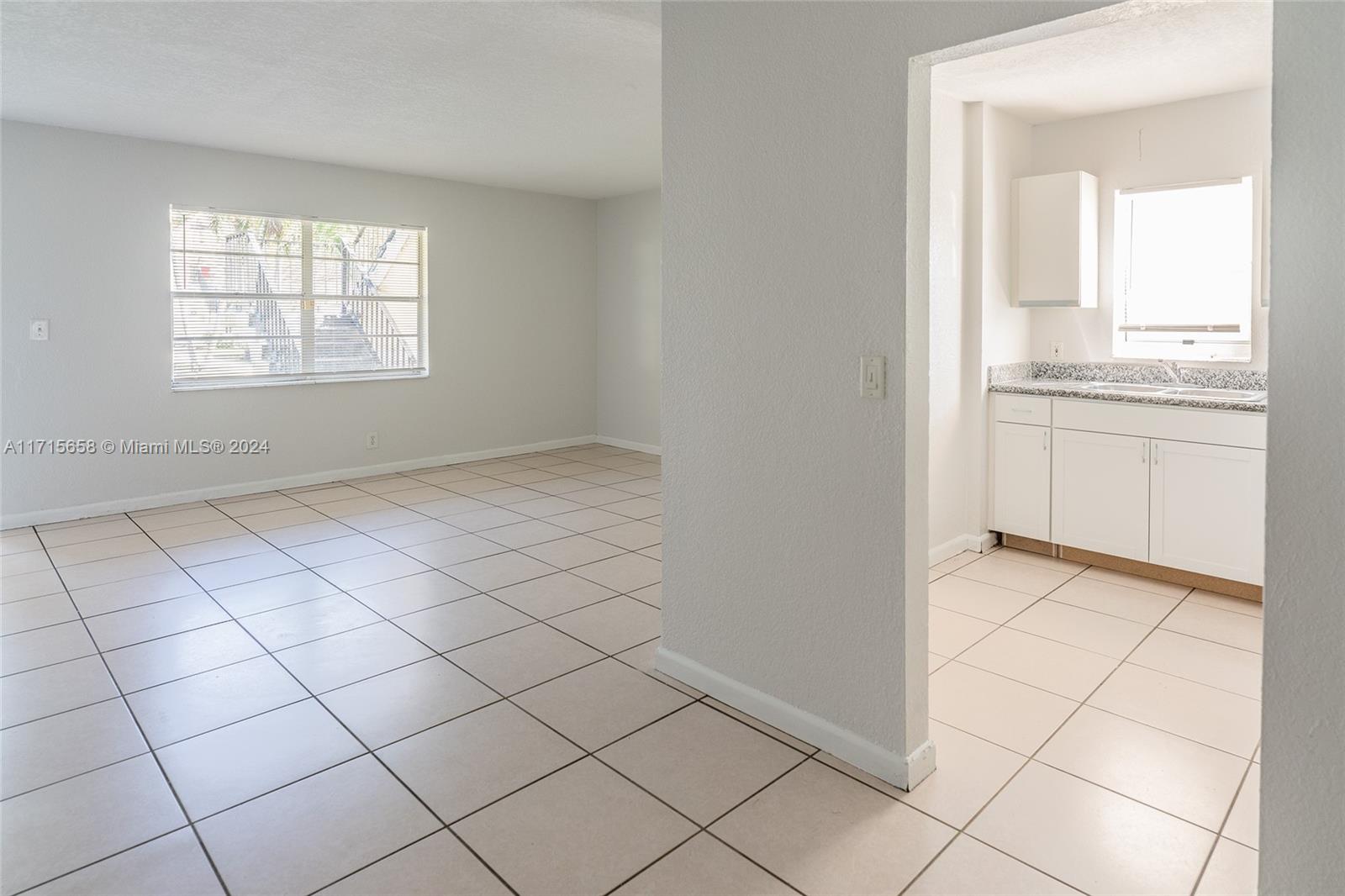 a view of an empty room and window