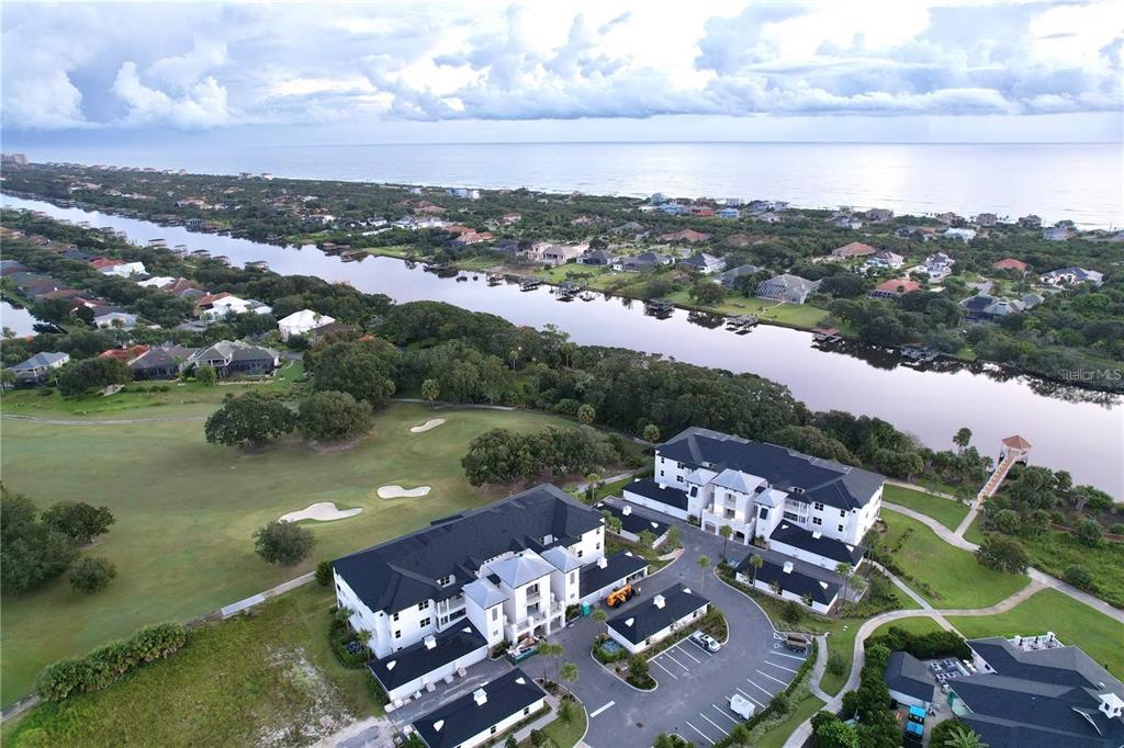 an aerial view of a house with a lake view