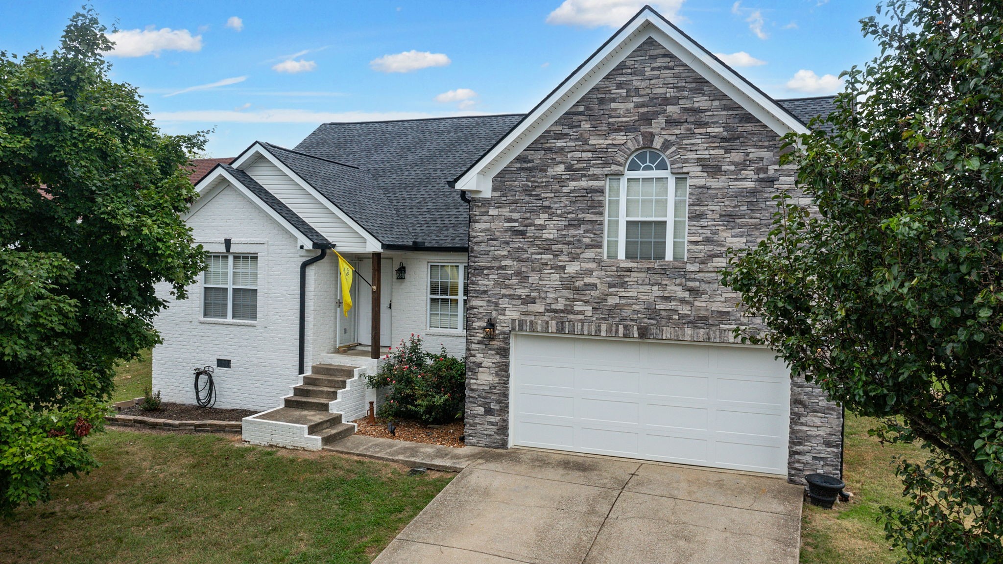 a front view of a house with a yard