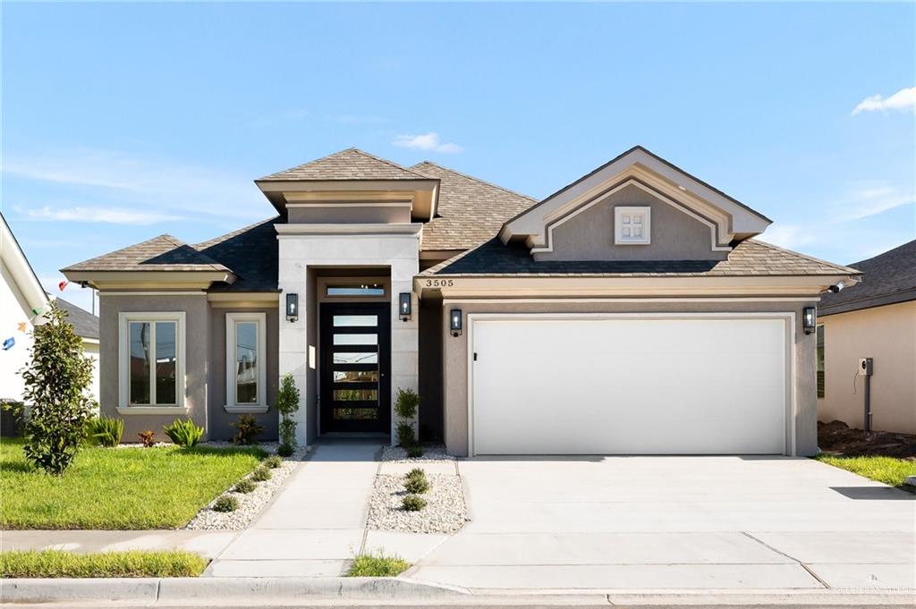 Prairie-style home featuring a garage