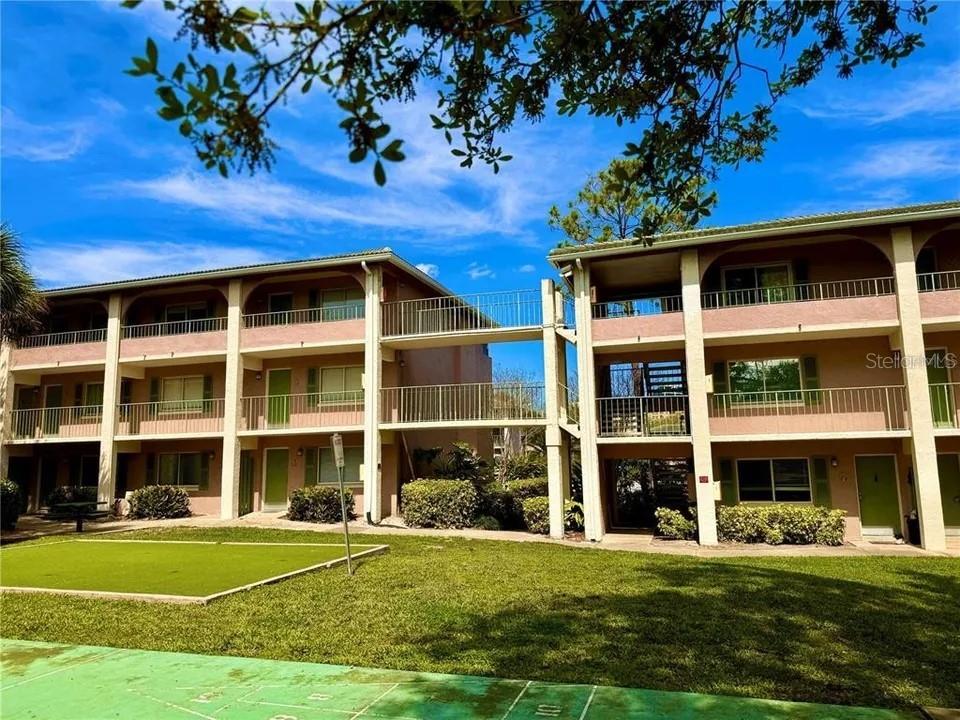 a view of a building with a garden