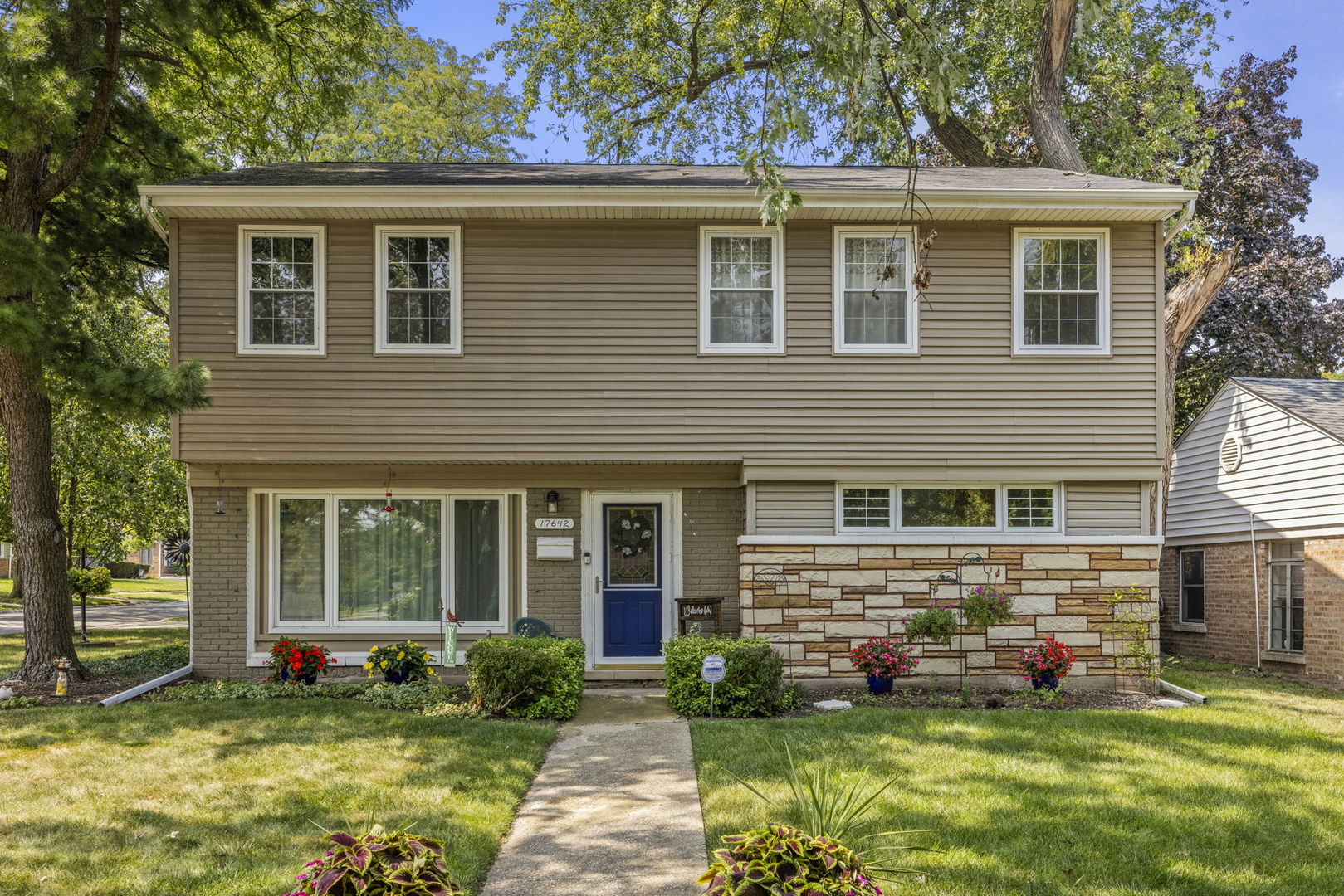 front view of a house with a yard