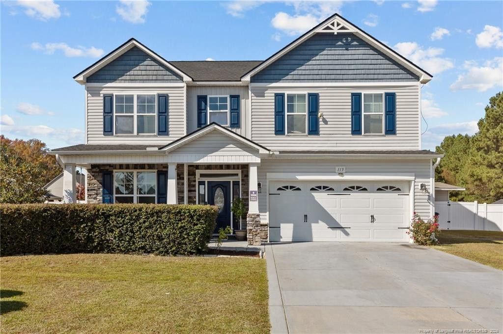 a front view of a house with garage