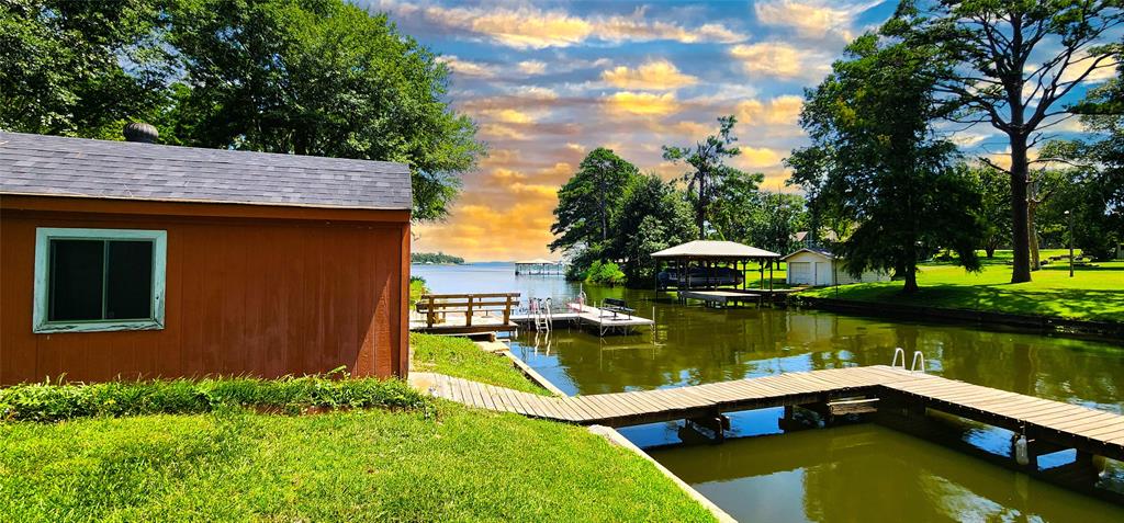 a view of a lake with a house in the background