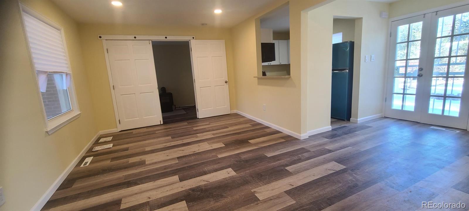 a view of an entryway with wooden floor and a window