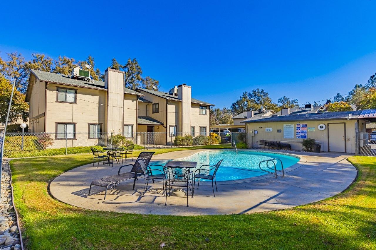 a swimming pool with outdoor seating