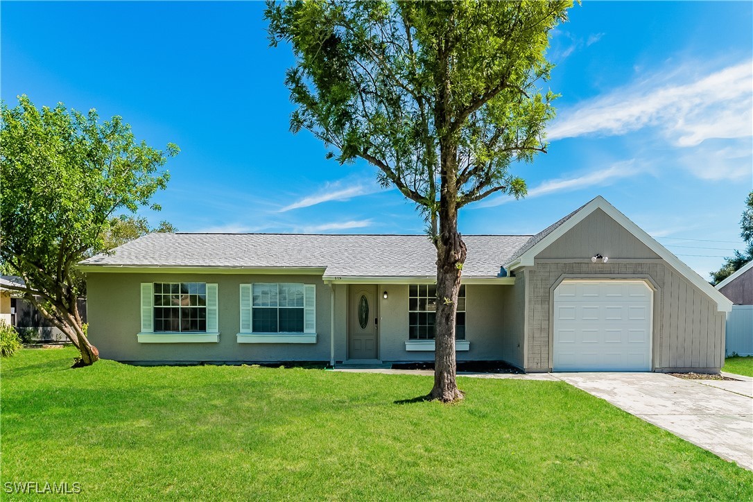 front view of a house with a yard