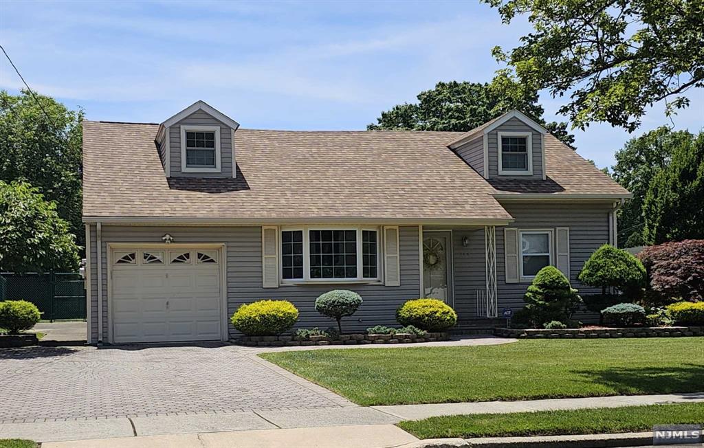 a view of a house with backyard and porch