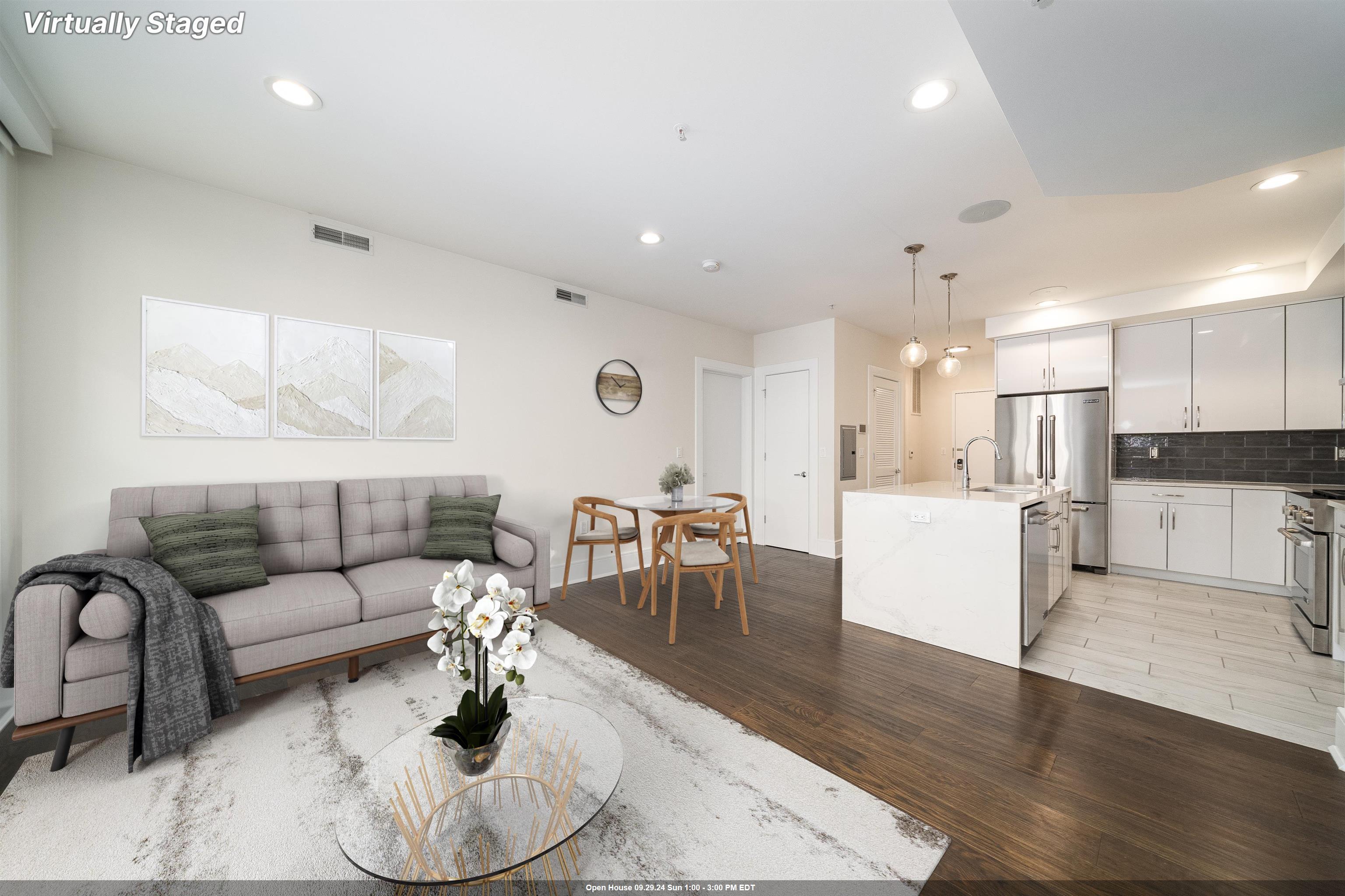 a living room with furniture kitchen and a table