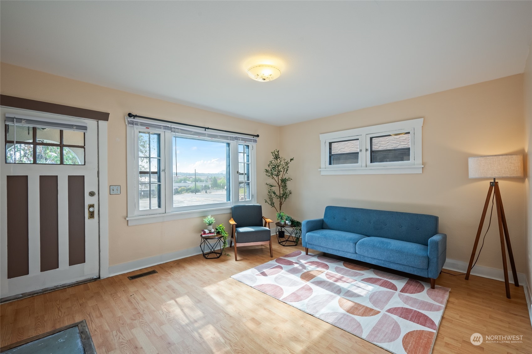 a living room with furniture and a window