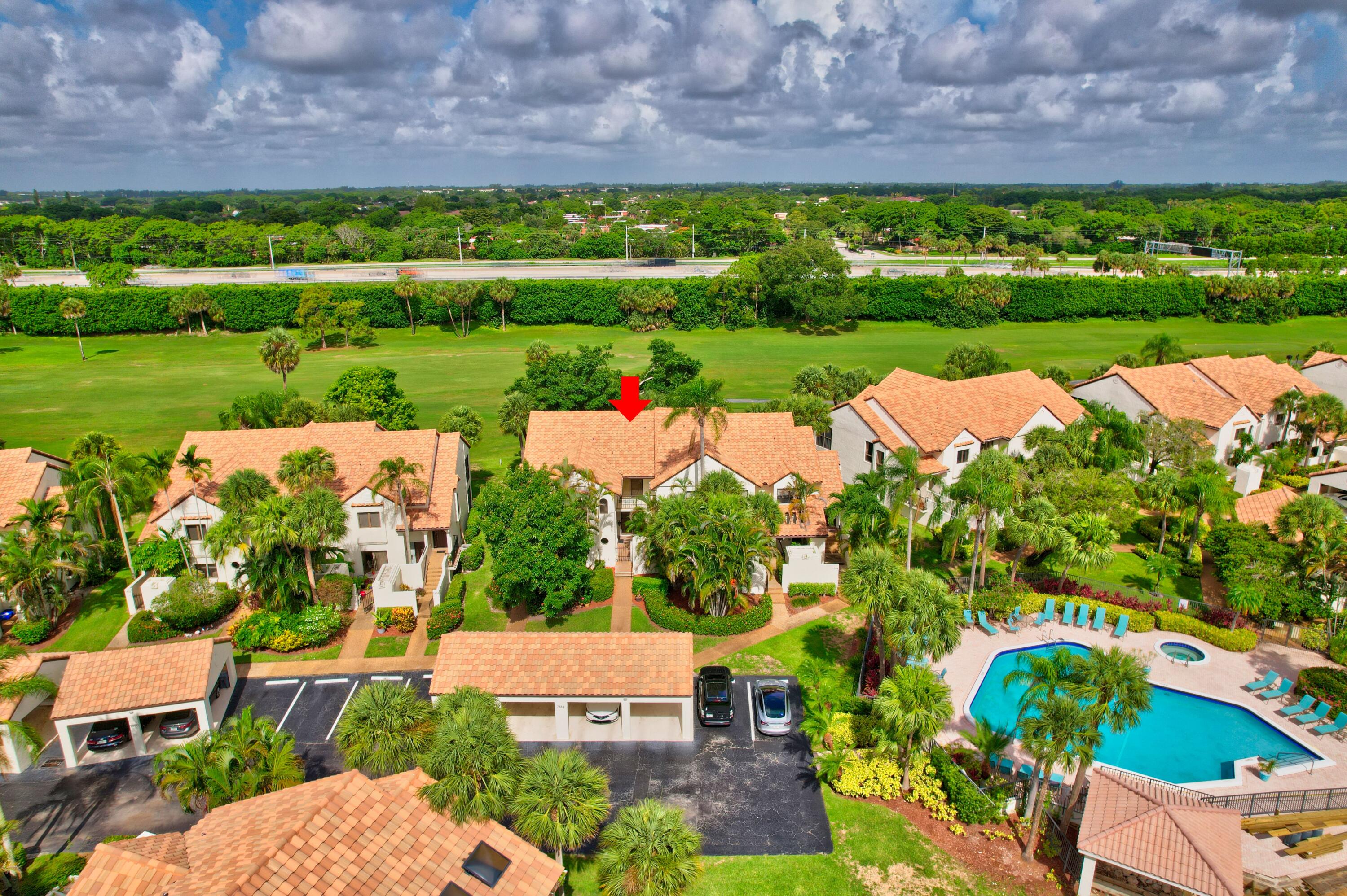 an aerial view of a house with a garden and a yard