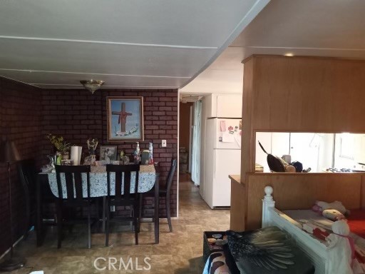 a view of a dining room with furniture and window