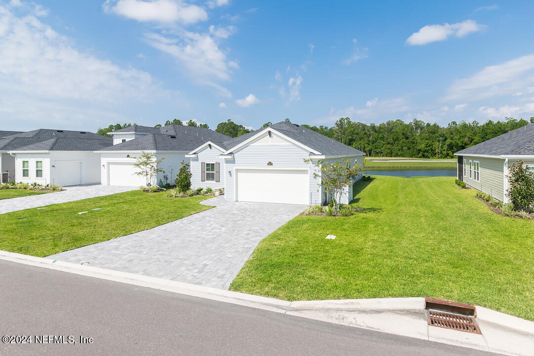 a view of house with outdoor space and street view