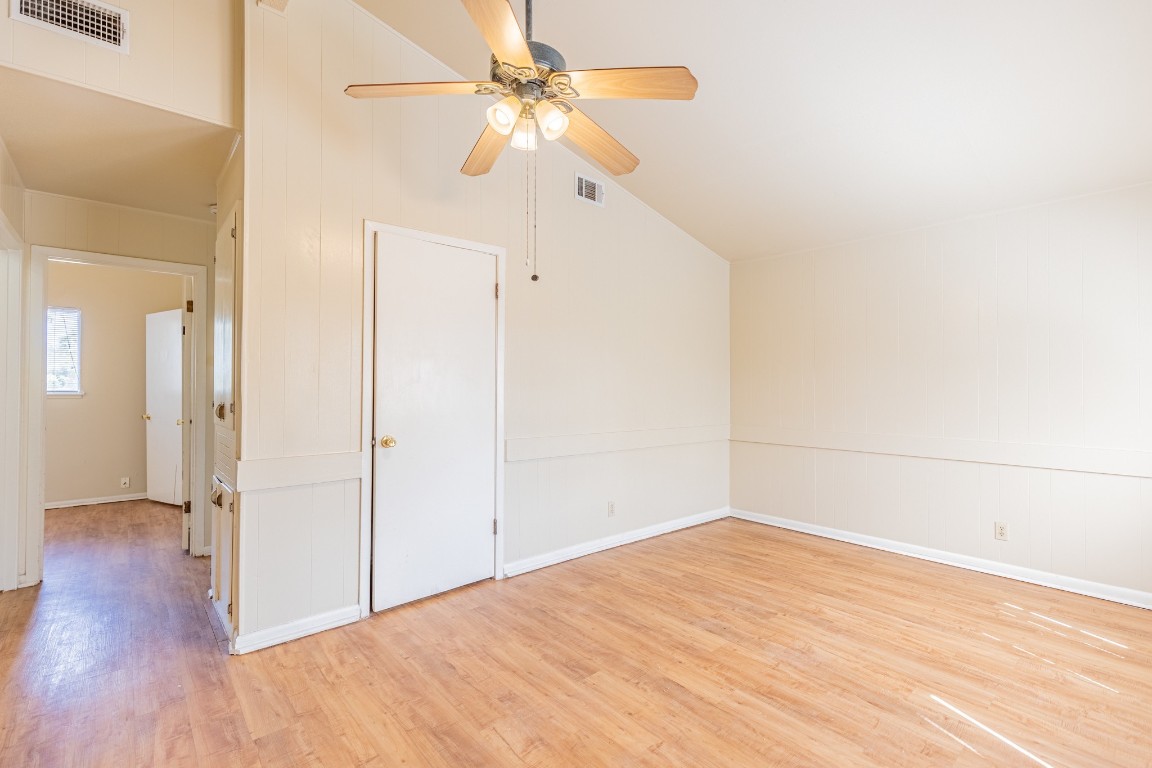 a view of a room with wooden floor