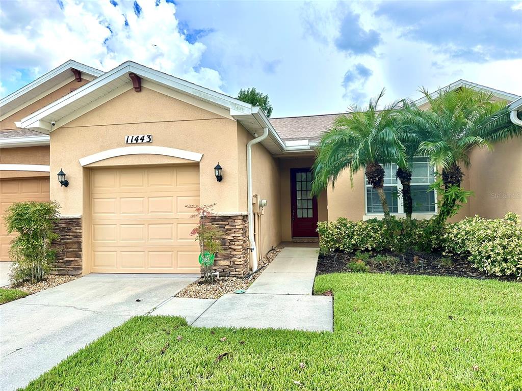 a front view of a house with a yard