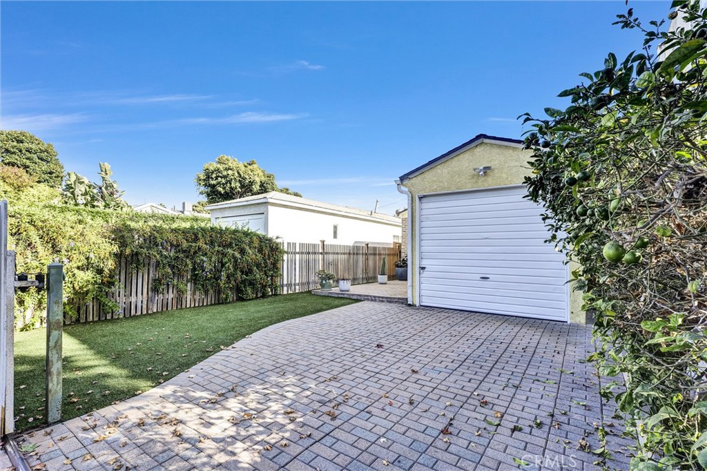 a view of a backyard of the house