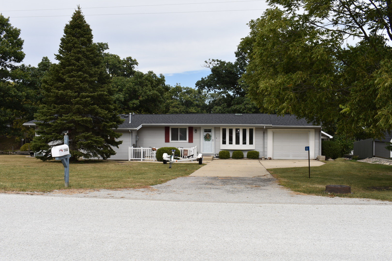 a front view of a house with yard